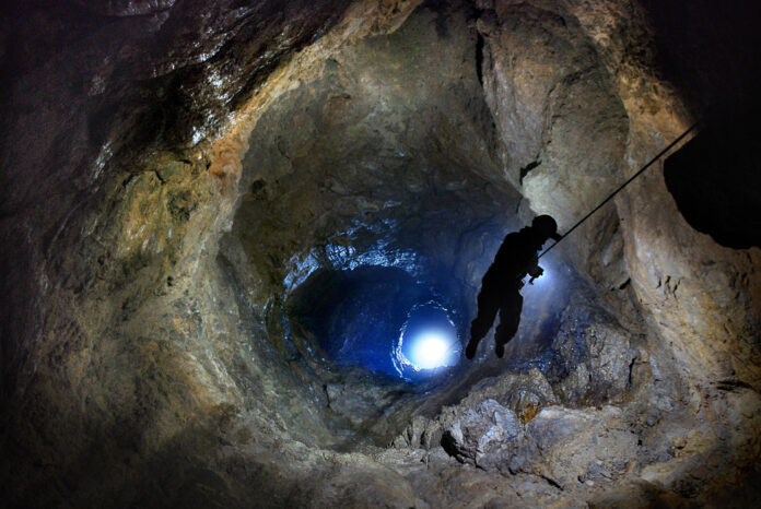 Speleologist,Descend,By,The,Rope,In,The,Deep,Vertical,Cave